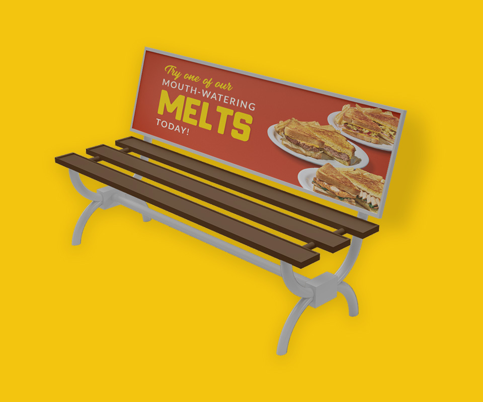 An ad for Denny's on a bench, showing off their Melts menu item